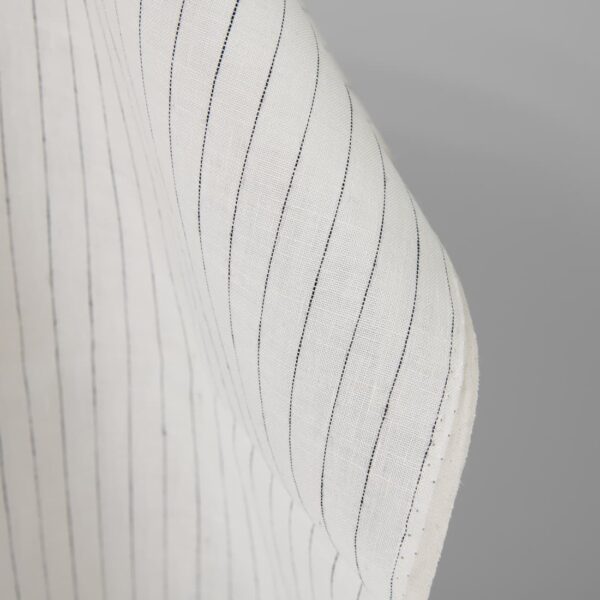 Linen fabric off-white colour with black stripes close up detail pinstripes