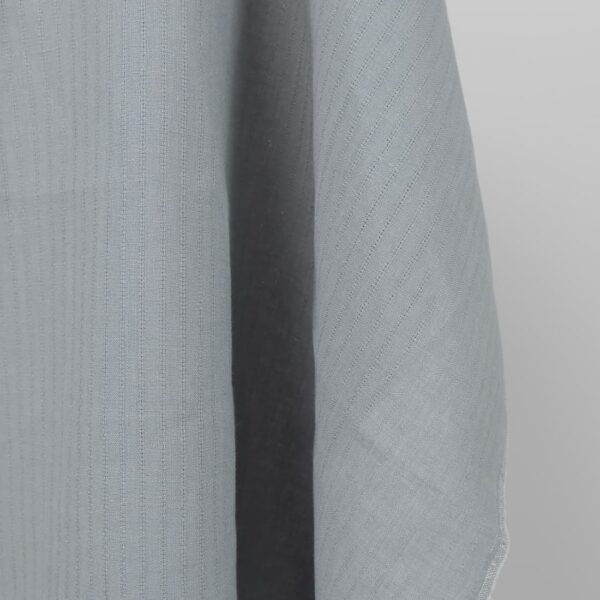 blue grey fabric with open stripes vertically.
