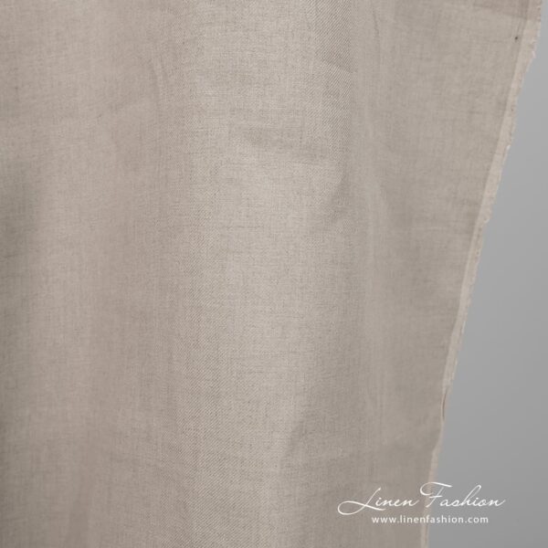 Linen fabric natural colour twill weave pattern close edge view
