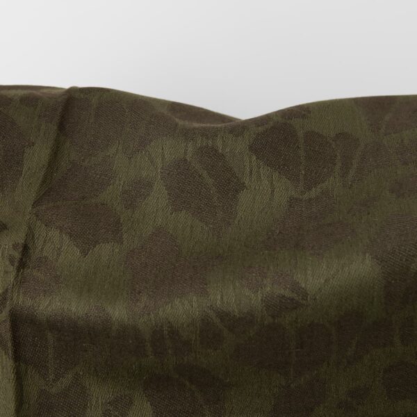 Green linen blend jacquard fabric close up detail