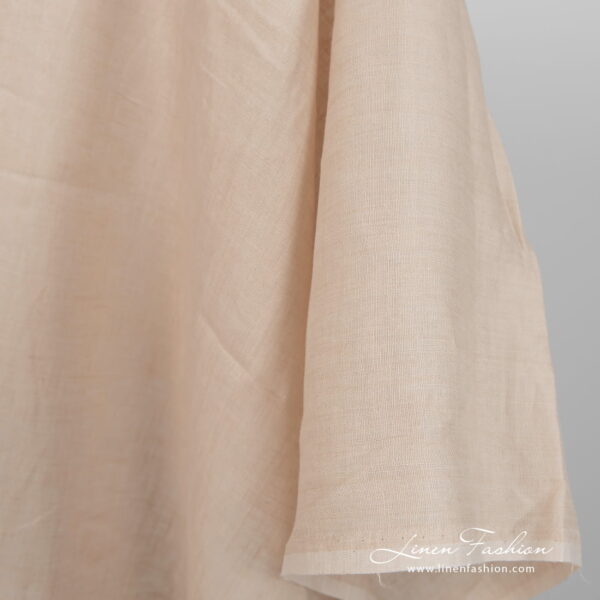 Lightweight linen fabric yellowish beige colour close up detail