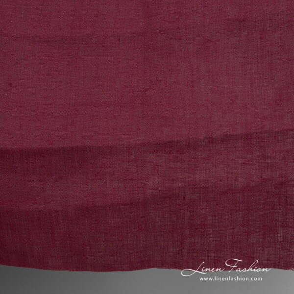 Linen fabric deep cherry colour close up detail