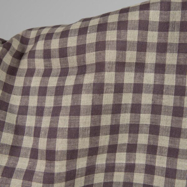 Linen fabric in natural and purple colour checks close up detail