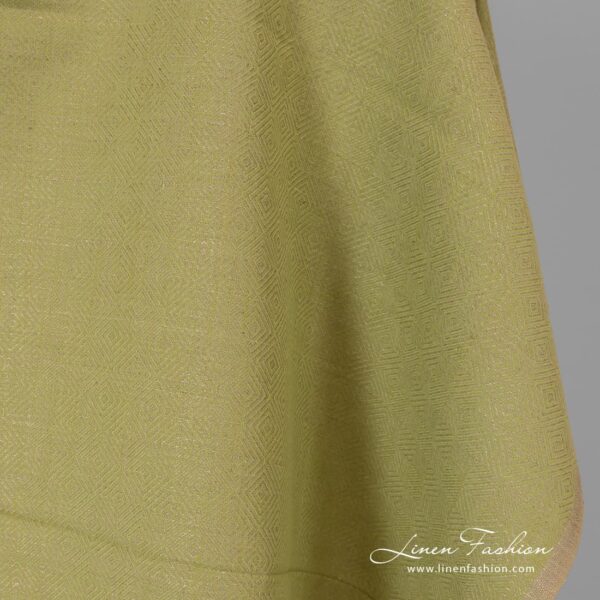 Diamond patterned green grey fabric.