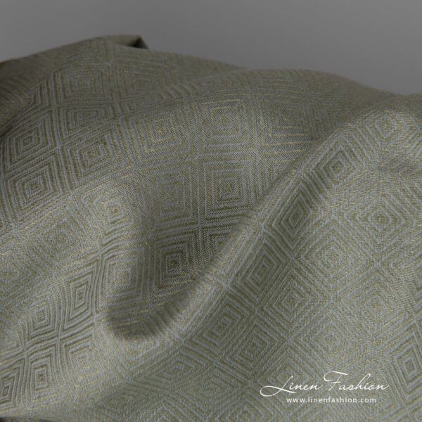 Linen cotton fabric in greyish green diamond pattern close up detail